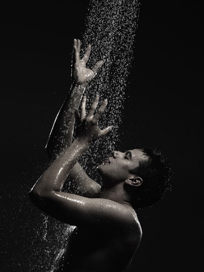 Caucasian man standing in shower