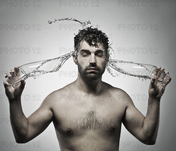 Man splashing himself with water