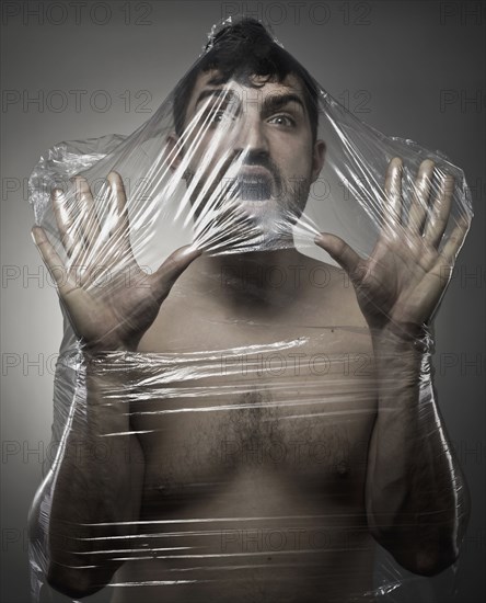 Man wrapped in plastic