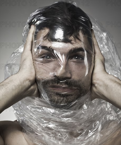 Man wrapped in plastic