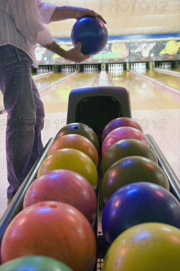 Bowler holding bowling ball