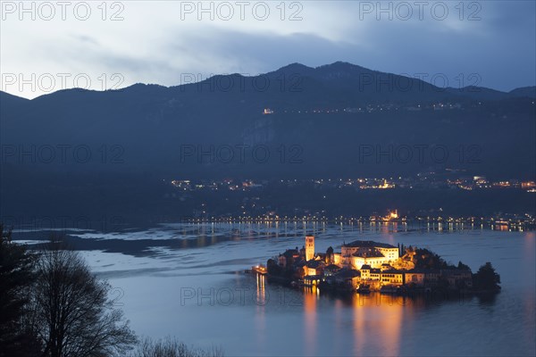 Illuminated island in Italian lake