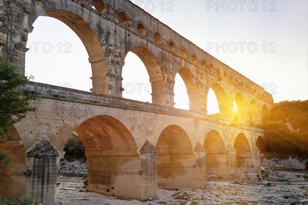 Sun shining through aqueduct