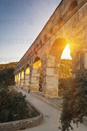 Sun shining through aqueduct