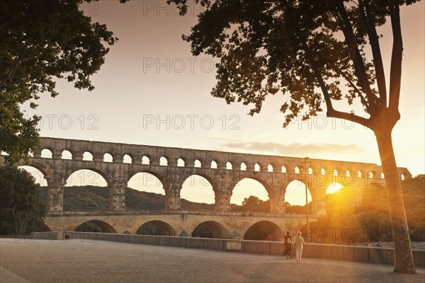 Sun shining through aqueduct