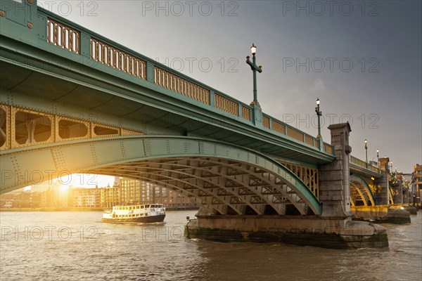 Boat and urban bridge