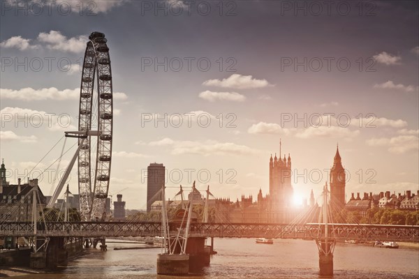 Sunset over bridge and London Eye