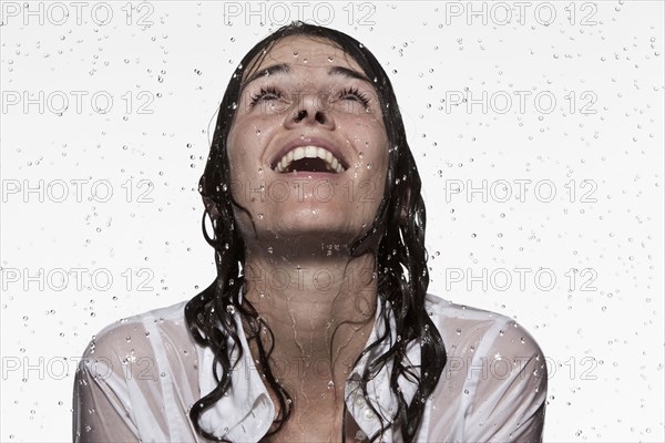 Rain falling on Caucasian businesswoman