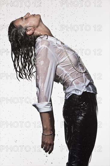 Rain falling on Caucasian businesswoman