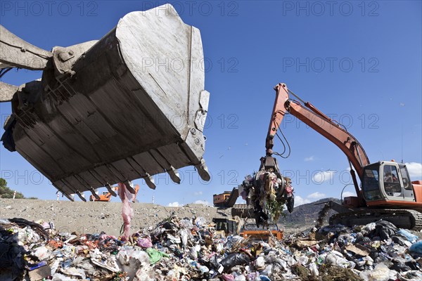 Machinery working in landfill