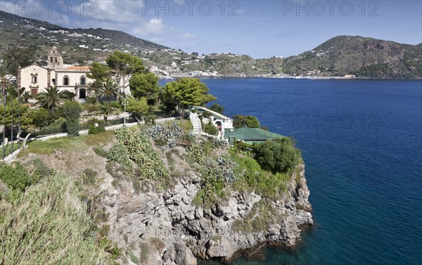 Building on cliff overlooking ocean