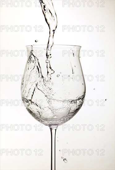 Water pouring into wine glass