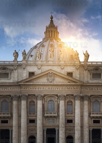 Sun behind columned building