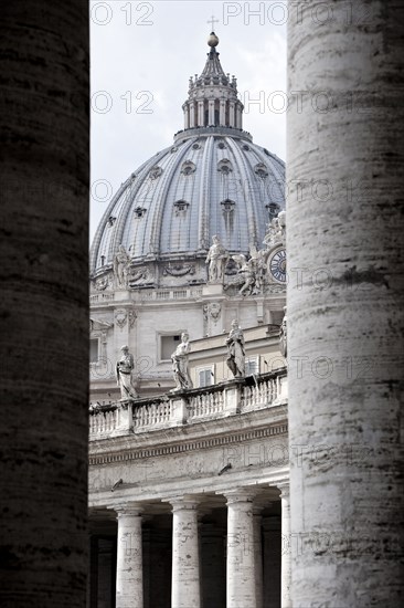 Ornate dome viewed from between pillars