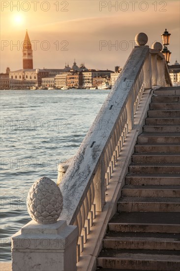 Railing on steps by canal