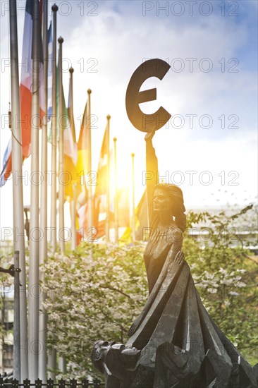 Statue with Euro symbol outside European Union Parliament