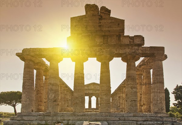 Sun rising over ancient ruins