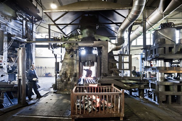 Workers in industrial steel factory