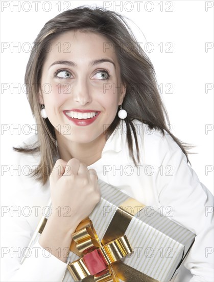 Smiling woman holding wrapped gift