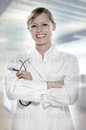 Hispanic doctor smiling in hospital