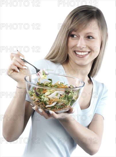 Hispanic woman eating salad