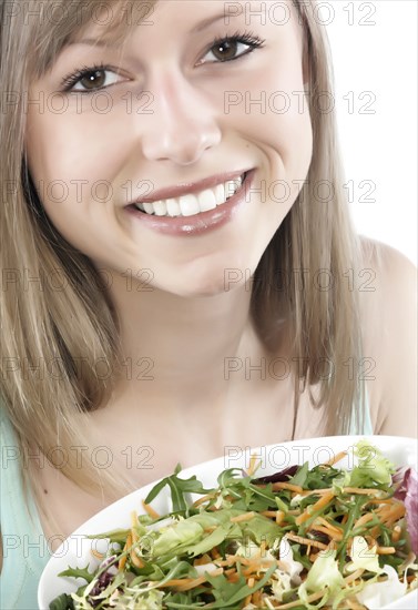 Hispanic woman eating salad