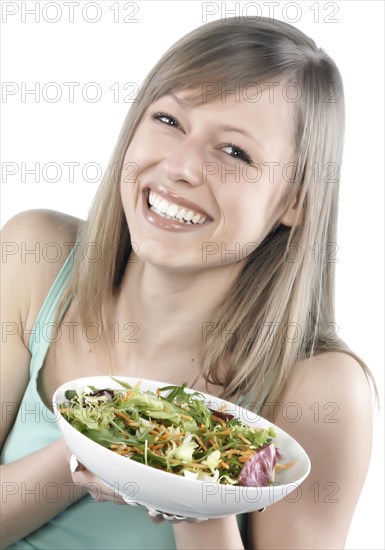 Hispanic woman eating salad