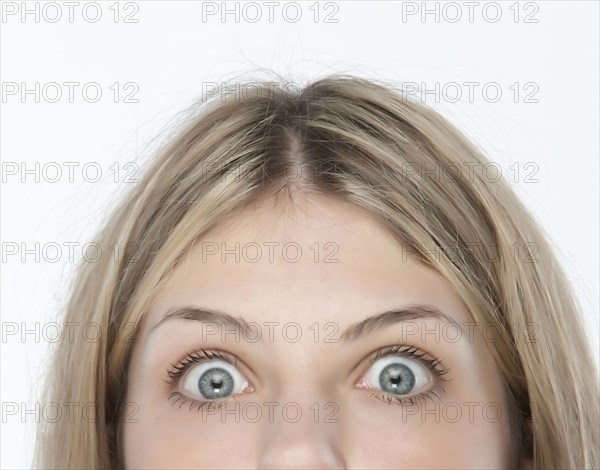 Close up of woman's eyes wide open