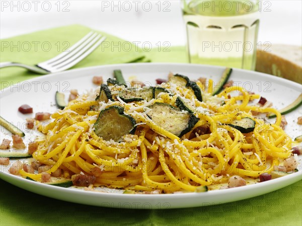 Close up of pasta with zucchini and cheese