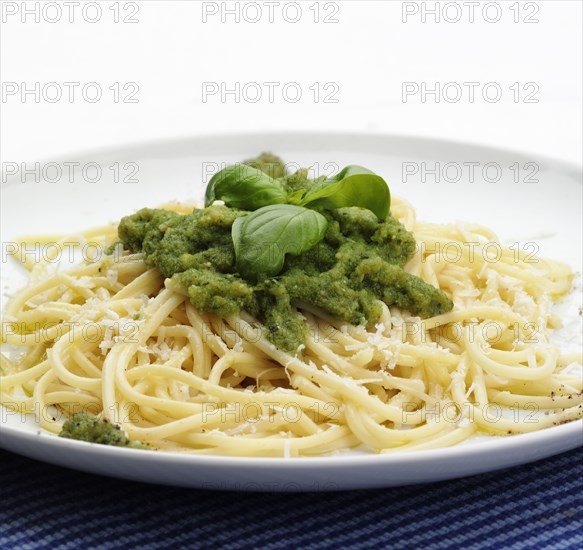 Close up of plate of pesto pasta