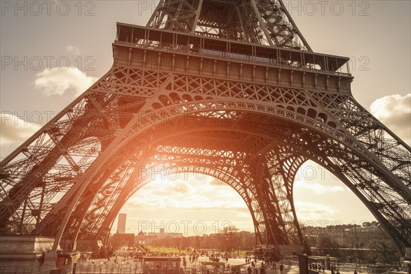 Tourists under Eiffel Tower