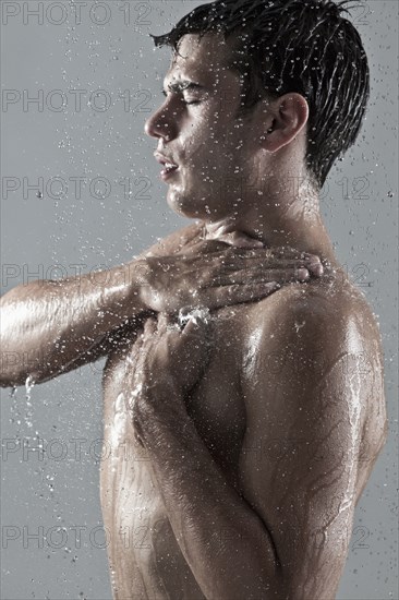 Caucasian man showering