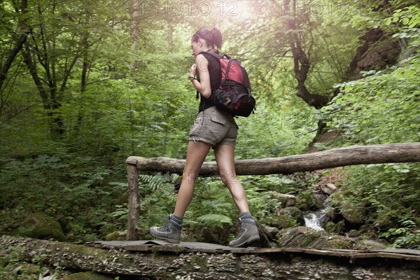 Caucasian woman hiking in forest