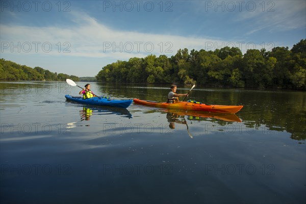 Couple kayaking in river