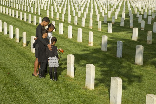 Black family at military cemetery