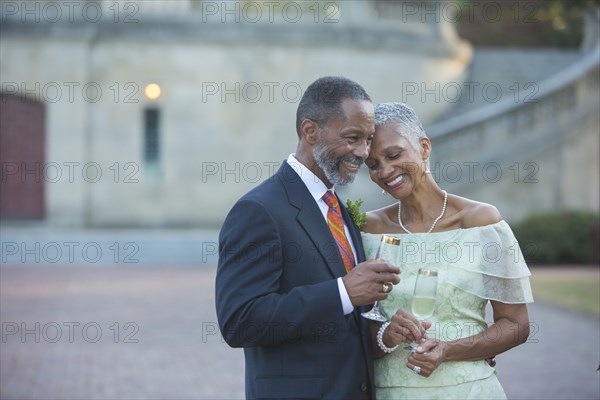 Black couple drinking champagne