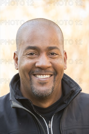 Close up of smiling Mixed Race man