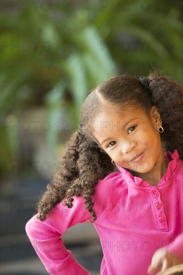 Portrait of smiling Mixed Race girl
