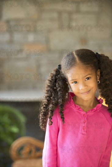 Portrait of smiling Mixed Race girl
