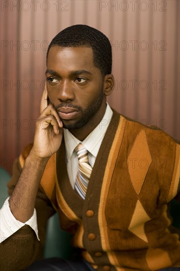 Well-dressed African man looking pensive