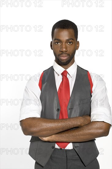 Well-dressed African man with arms crossed