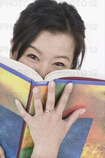 Portrait of woman reading book