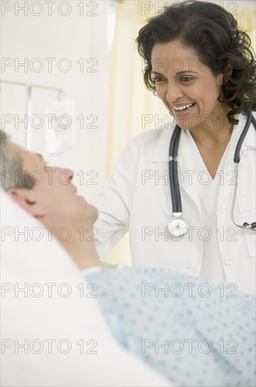 Female doctor talking to male patient