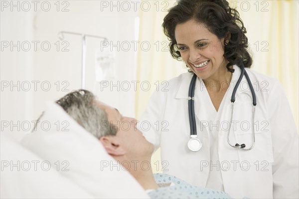 Female doctor talking to male patient