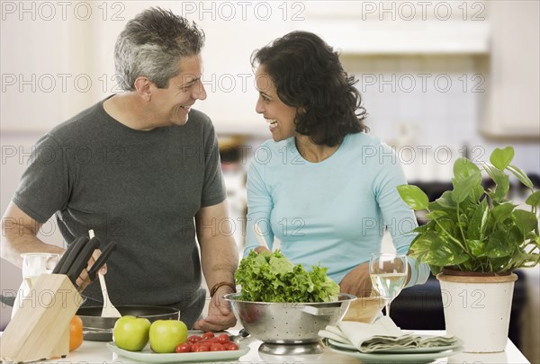 Couple cooking in kitchen