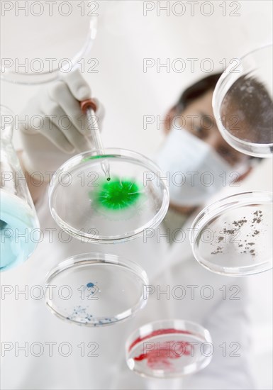 Man in lab with petri dishes
