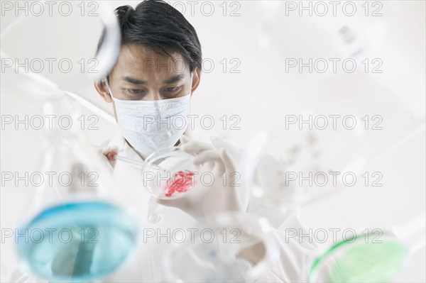 Man in lab with petri dishes