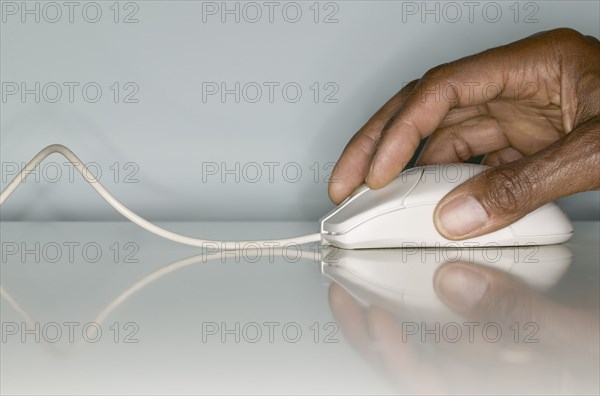 Close up of hands on computer mouse