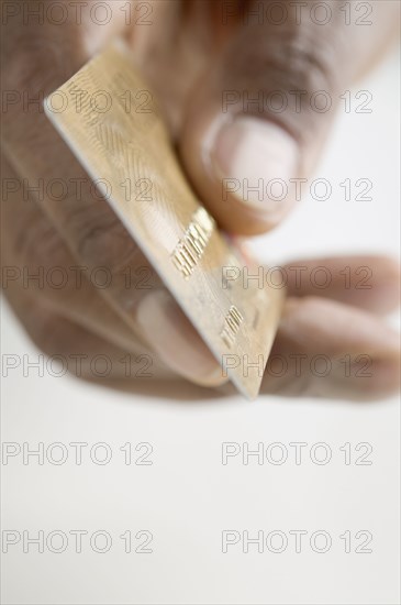 Close up of hand holding credit card