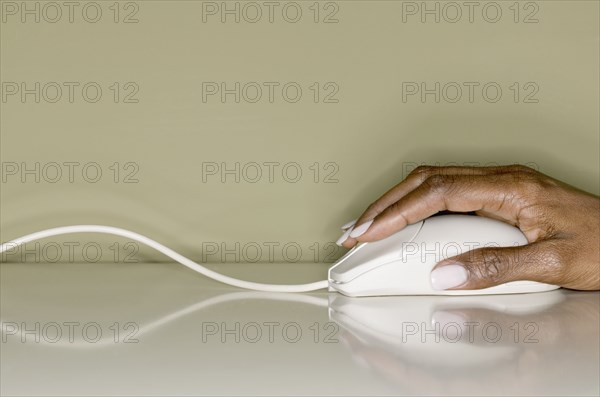 Close up of hand with computer mouse